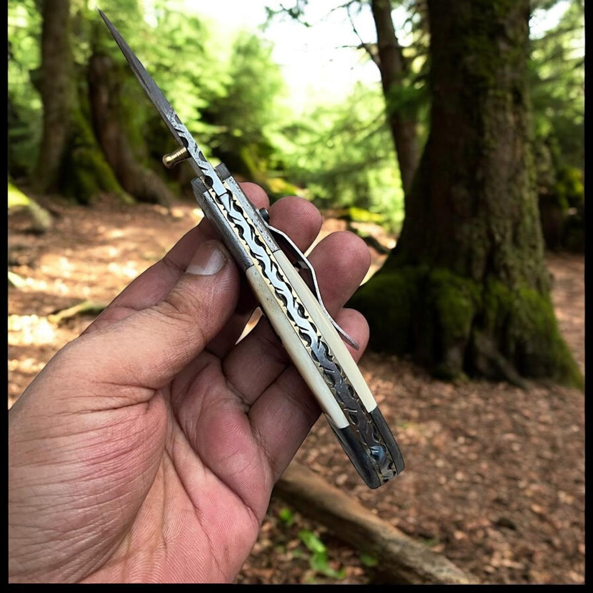 Experience Freedom with the Patriotic Damascus Folding Knife – Camel Bone Handle Edition - RFE Marketing Ventures