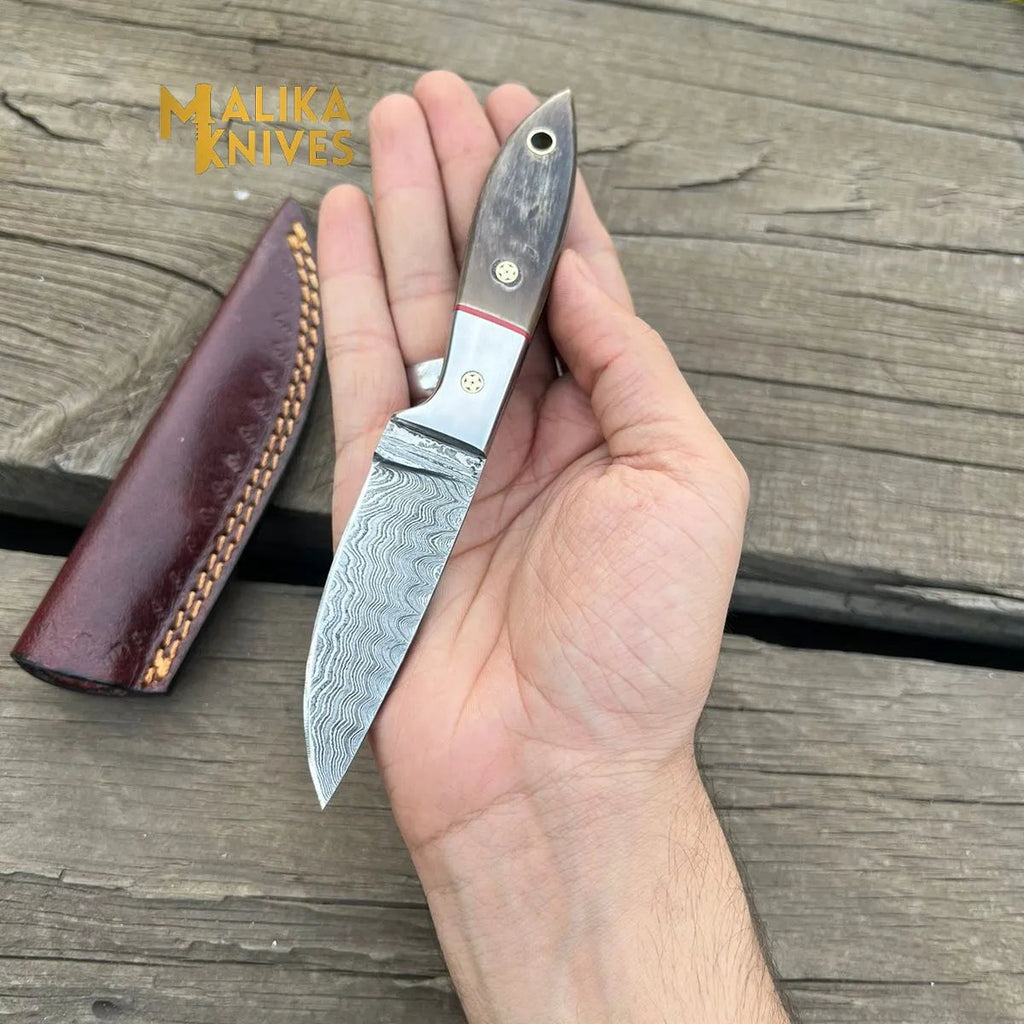 Damascus Steel Skinner Knife - Unmatched Precision with Genuine Ram Horn Handle for Outdoor Enthusiasts - RFE Marketing Ventures